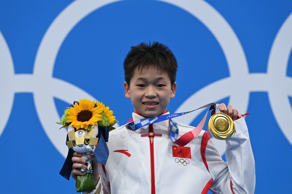 China’s Quan, 14, wins Olympic gold with three perfect dives