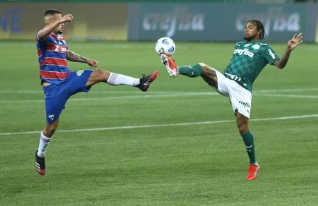Soccer-Palmeiras lose to injury time goal but stay top in Brazil
