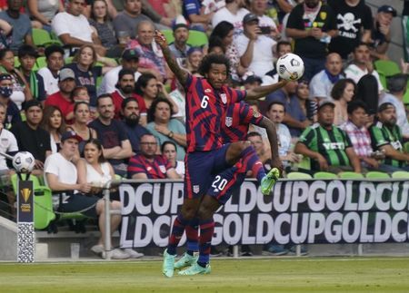 Soccer-Venezia sign American Busio, bring in Caldara on loan