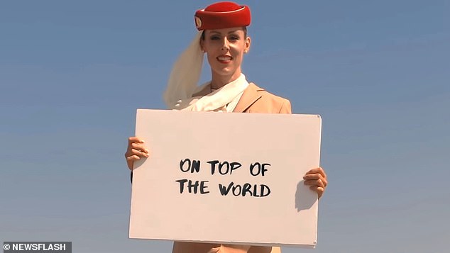 The ultimate high-flyer: Fearless 'airline stewardess' perches on top of the 2,722ft Burj Khalifa as an Emirates A380 thunders past for daredevil commercial