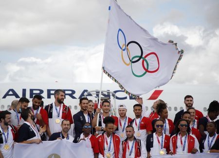 Flying the Olympic flag, Paris looks beyond COVID for 2024 games