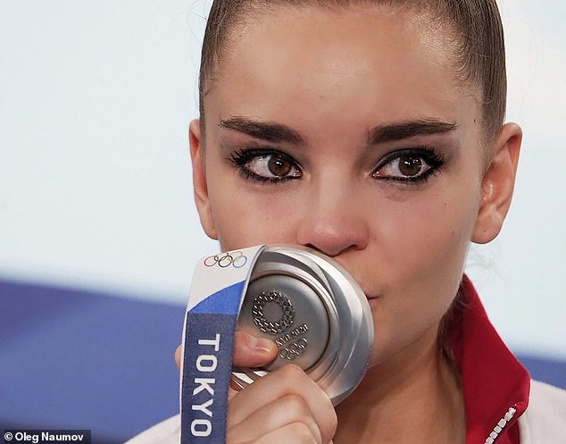 Former Olympic champion believed to be Putin's 'secret first lady' appears first time in two years to blast Tokyo judges who did not award Russian gymnast a gold medal