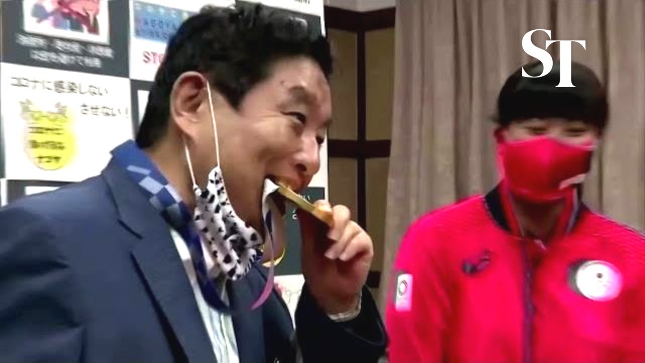 Outrage after Japan mayor bites Olympic medal