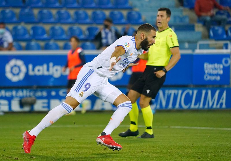 Soccer-Benzema double helps Real to winning start at Alaves
