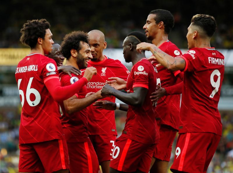 Soccer-Liverpool cruise past Norwich in opener