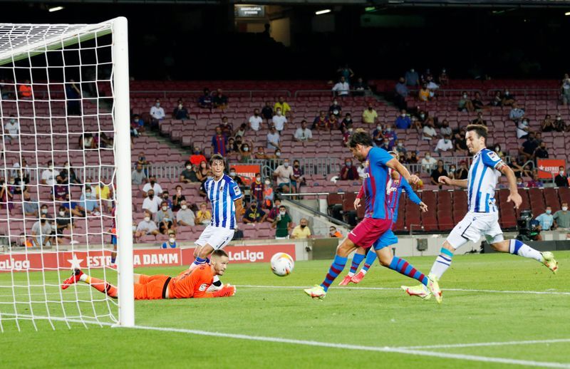 Soccer-Barca sink Real Sociedad in first game without Messi