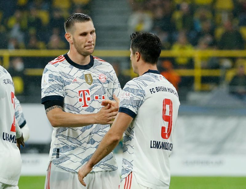 Soccer-Lewandowski double downs Dortmund as Bayern Munich win Super Cup