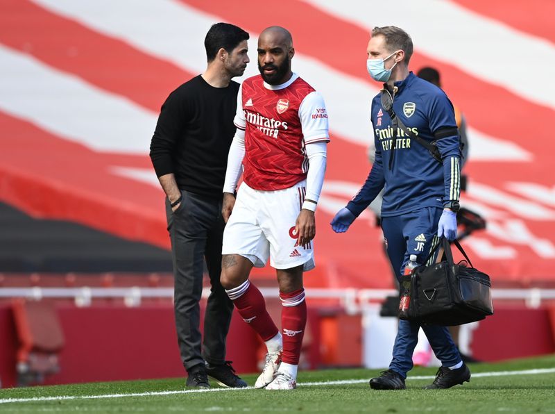 Soccer-Aubameyang and Lacazette among four positive Covid cases at Arsenal