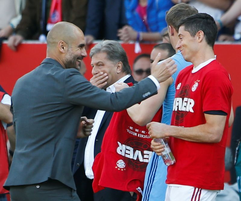 Soccer-Guardiola laughs off Lewandowski question, happy with City squad