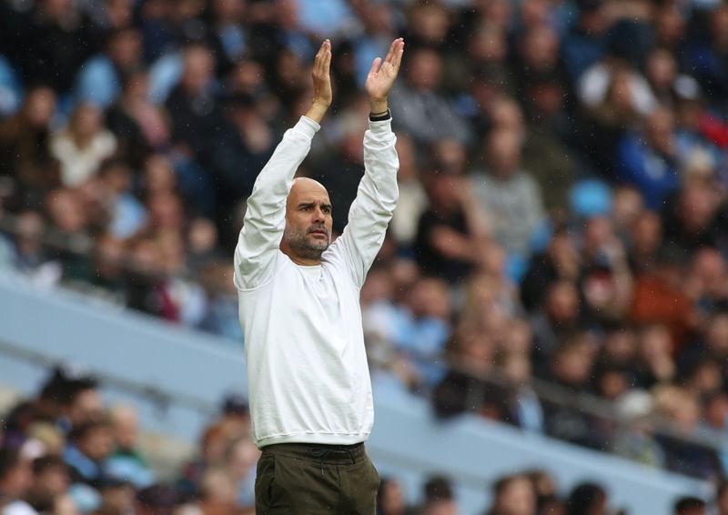 Soccer-Guardiola says he has no plans to leave Man City in 2023