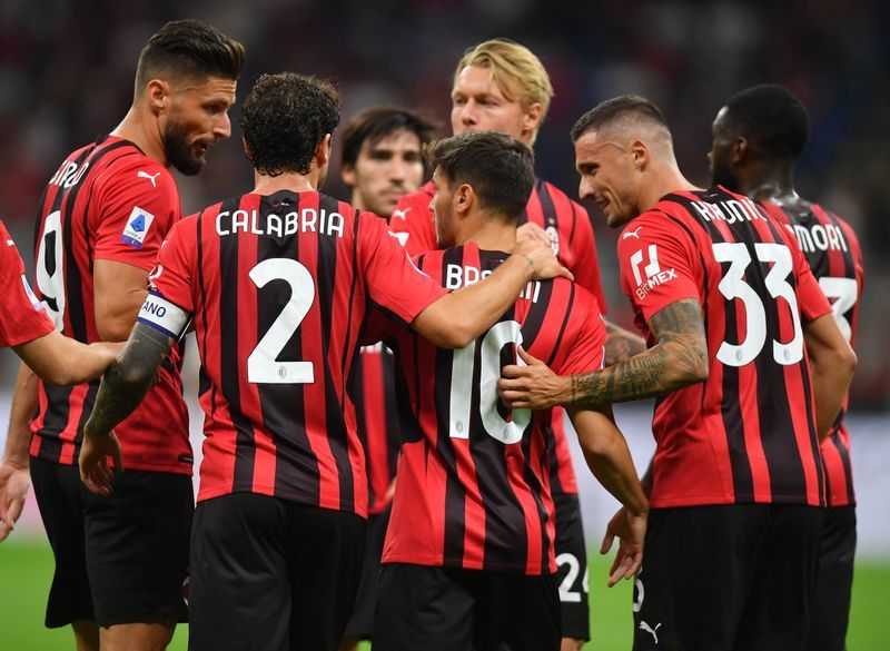 Soccer-Giroud double fires AC Milan to win over Cagliari