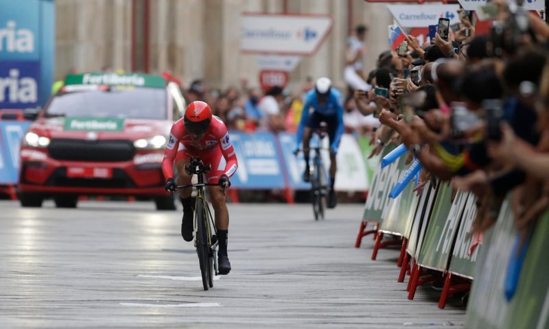 Cycling-Roglic claims Vuelta hat-trick