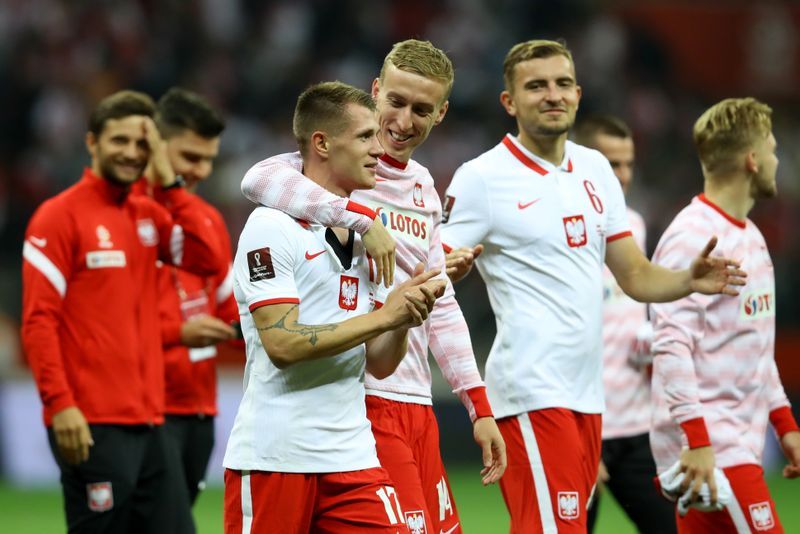Soccer-Poland level late to end England's winning streak