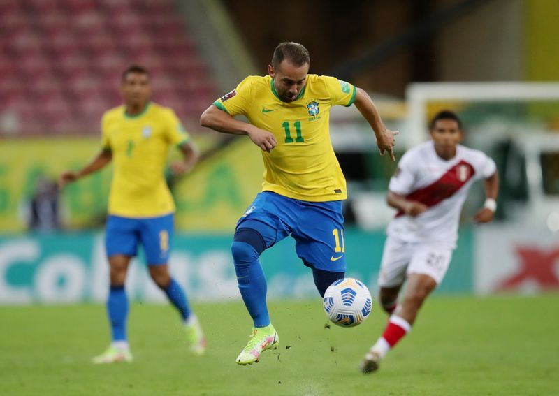 Soccer-Brazil score twice in first half to beat Peru 2-0