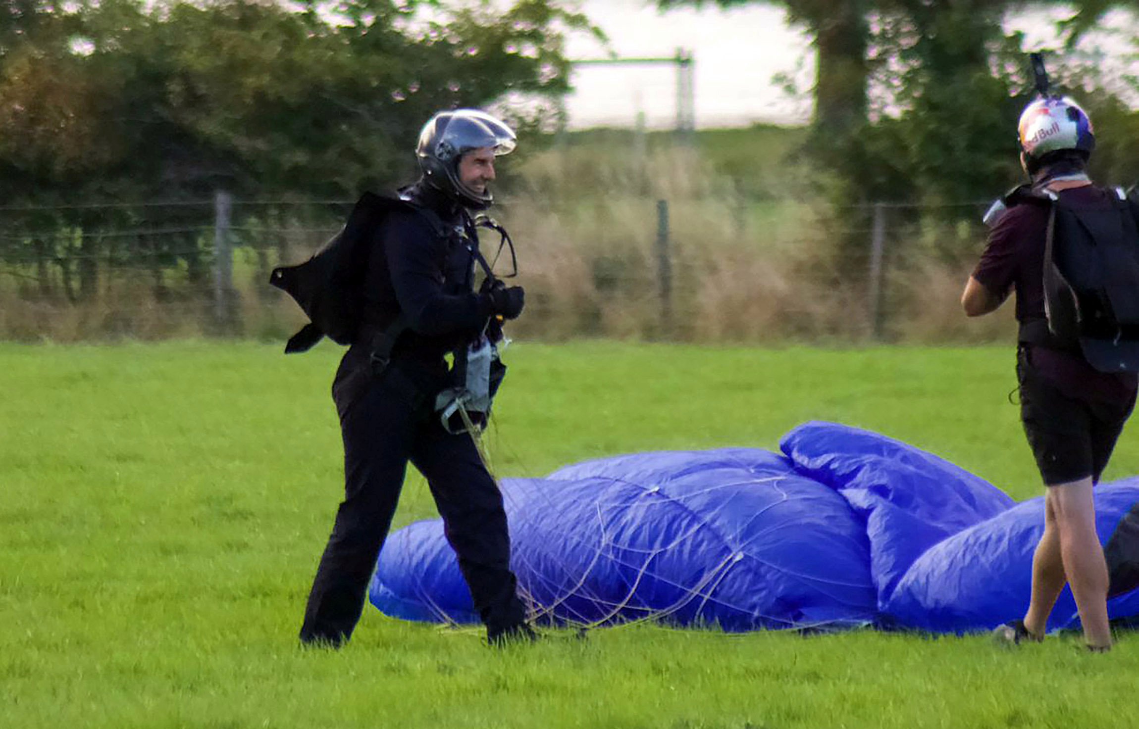 Tom Cruise is the ultimate stunt actor as he parachutes out of a helicopter filming Mission: Impossible 7 in the Lake District