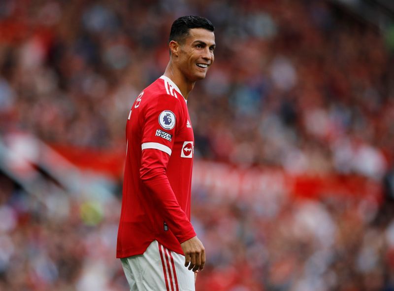 Soccer-Ronaldo takes United joint top with Chelsea, City win and Spurs slump