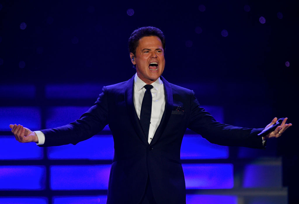 Donny Osmond, 63, didn’t think he’d ever walk again after surgery infection left him paralysed: ‘I wasn’t able to move’