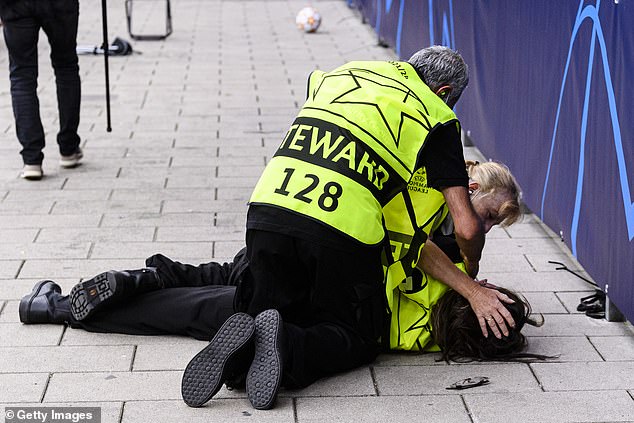 Ronald-oh! Man United star KNOCKS OUT female steward with wayward shot in warm-up before Champions League clash at Young Boys (before giving her a shirt after checking she was OK)