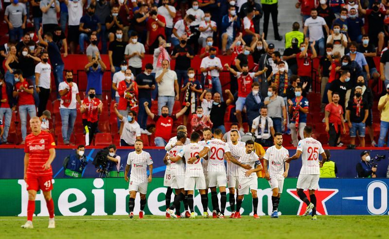 Soccer-Sevilla draw with Salzburg after four first-half penalties awarded