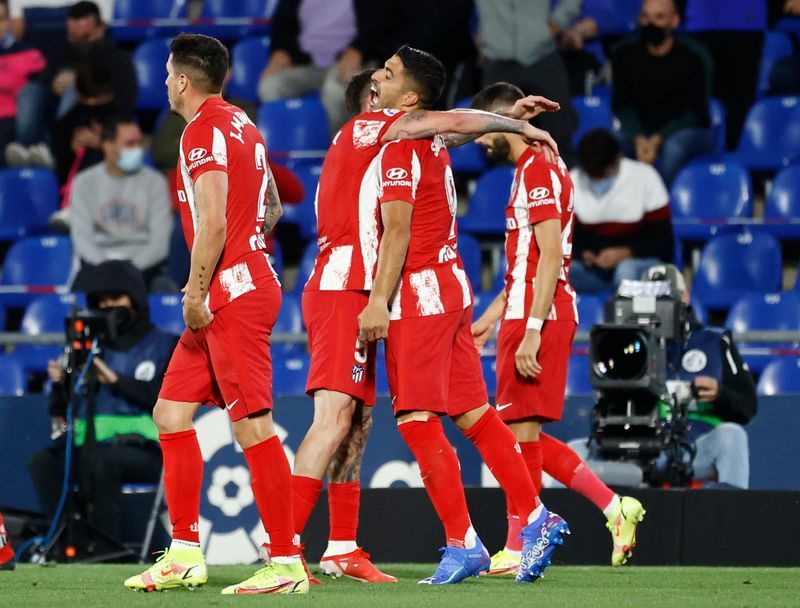 Soccer-Suarez double hands Atletico comeback victory at Getafe
