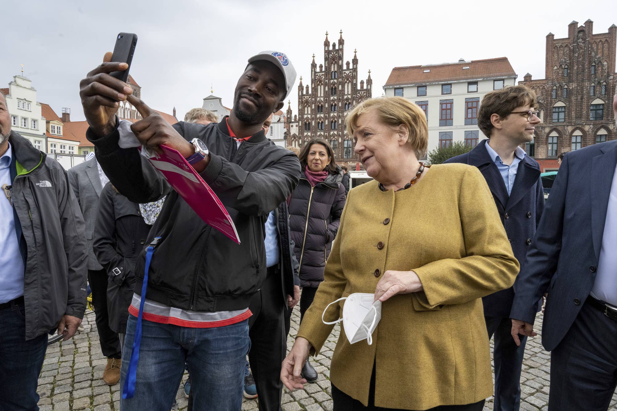 Danke Schön For These Photos Of Angela Merkel Getting Swamped By Birds