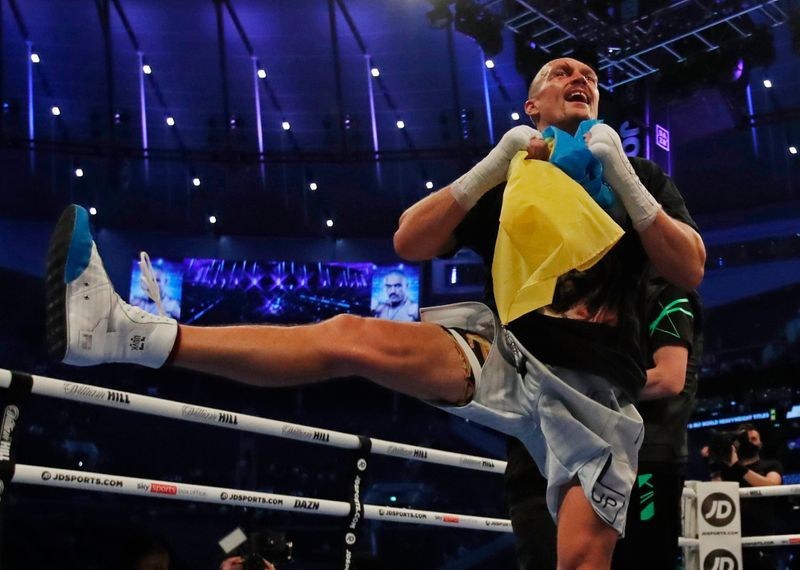 Boxing-Usyk says heavyweight title can't compare with Olympic gold