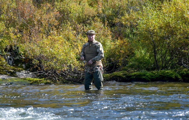 Caught on camera: Kremlin releases photos of Putin's Siberian fishing trip