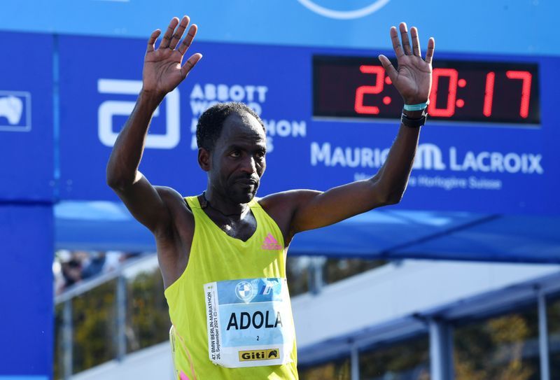 Athletics-Ethiopian Adola digs deep to win Berlin marathon, Bekele third