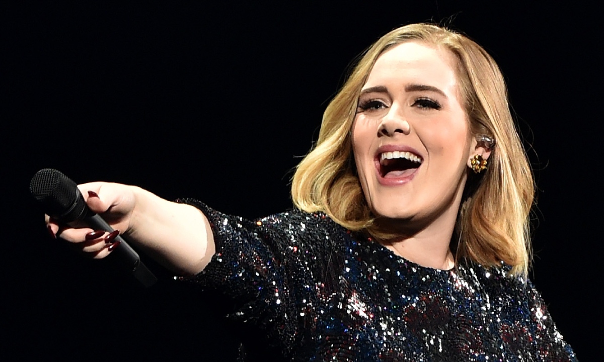 Adele surprises fans with music video announcement in show-stopping new look