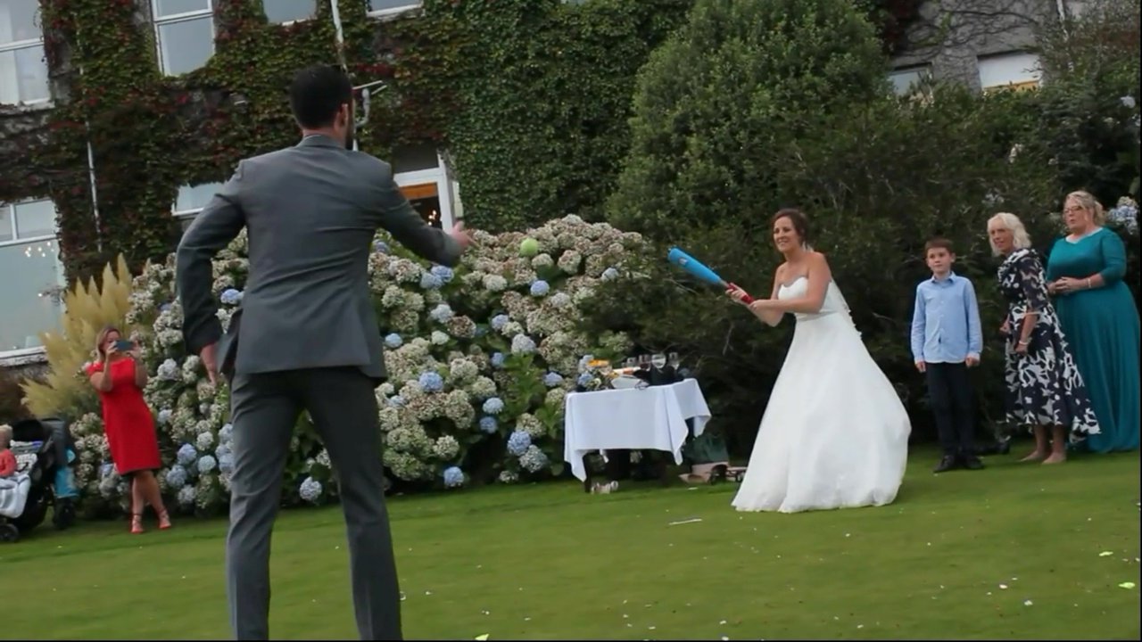 Bride smacks ball into her husband’s groin in wedding day rounders game – but still completes her run