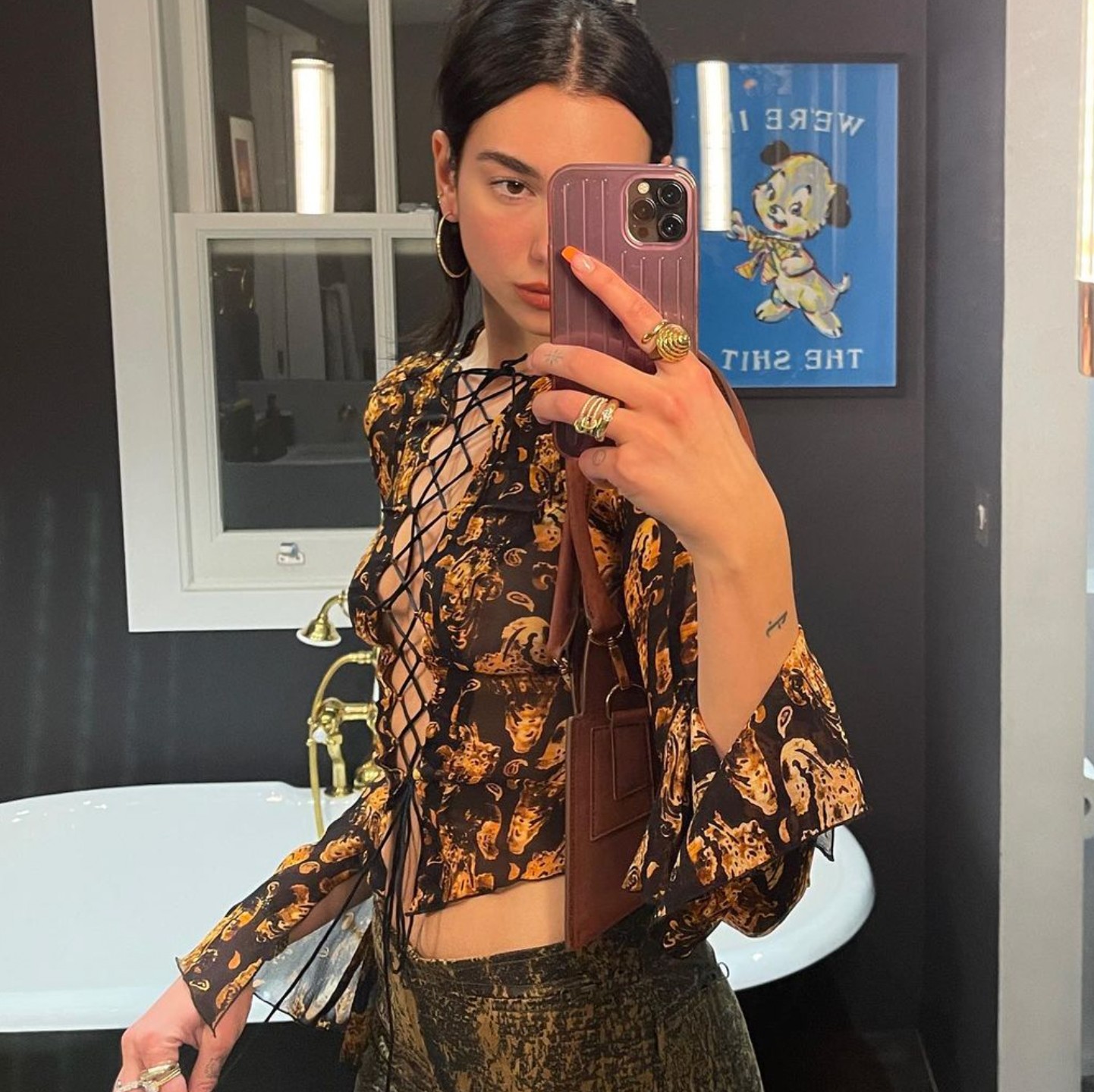 Dua Lipa Went Braless in a Sheer Lace-Up Shirt