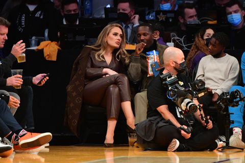 Adele Wears a Luxe Leather Suit and Louis Vuitton Monogram Coat to an NBA Game