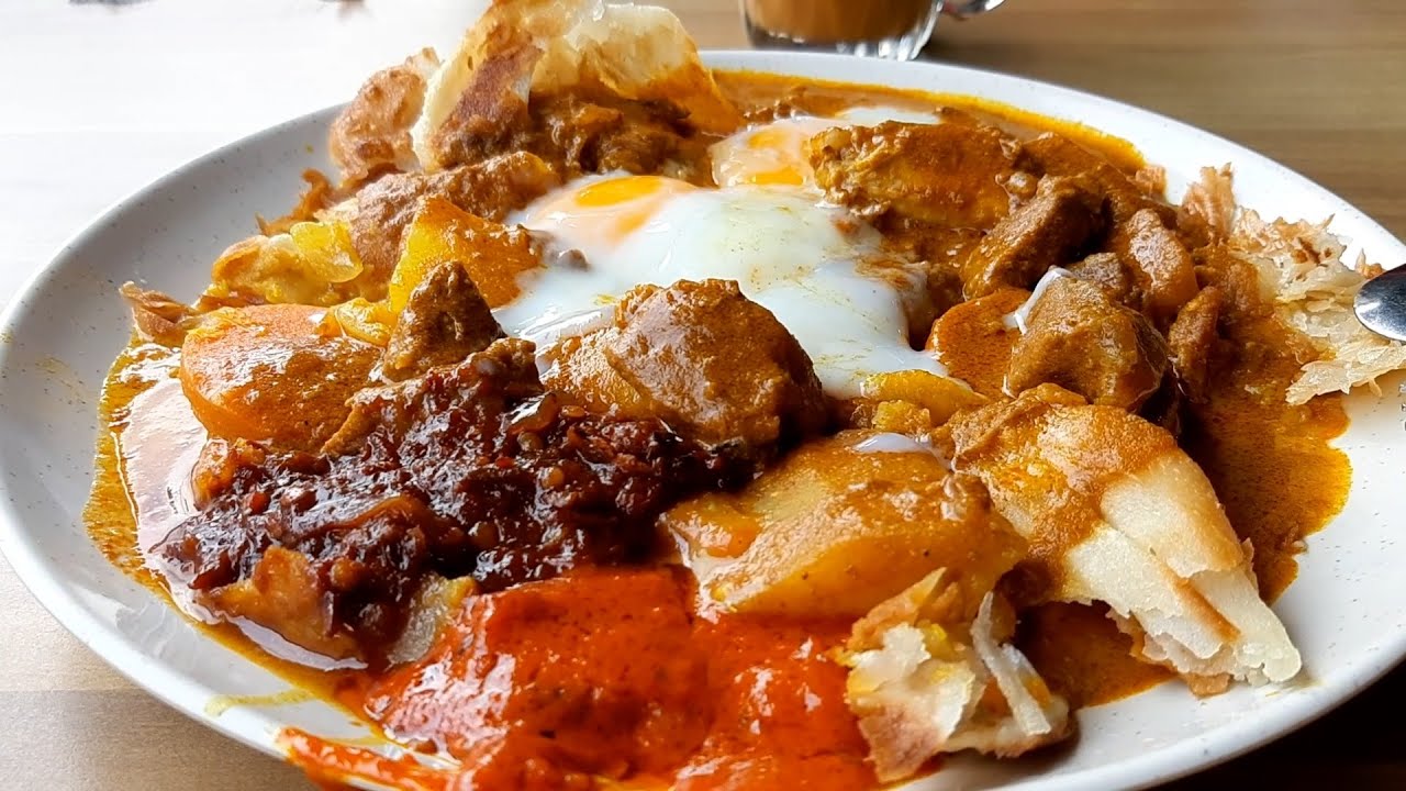 RK Eating House. Roti Tsunami. A Huge Mess of Different Curry with Prata but Just so Yummy.