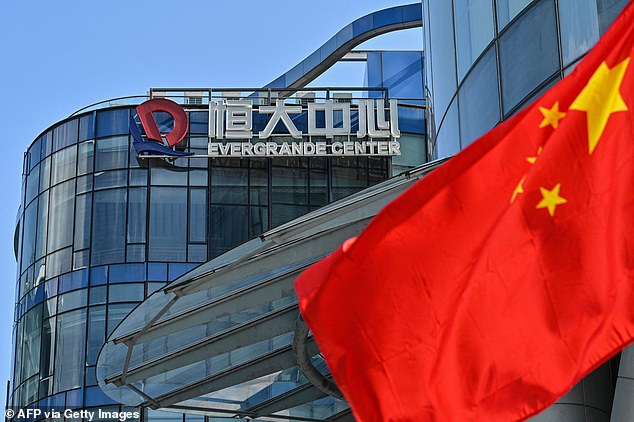 Chinese property giant Evergrande defaults on $300billion debt: Beijing prepares 'controlled demolition' of the firm to protect its economy amid fears it could have global consequences
