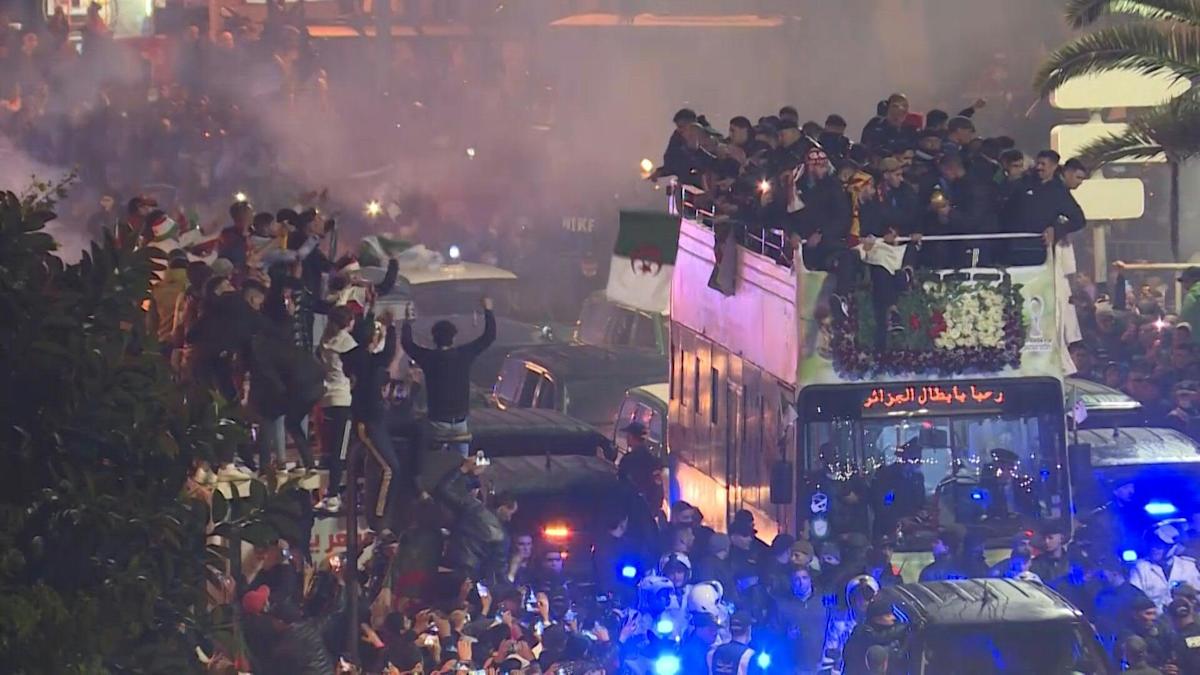 Football: algeria team celebrate arab cup triumph with fans at home