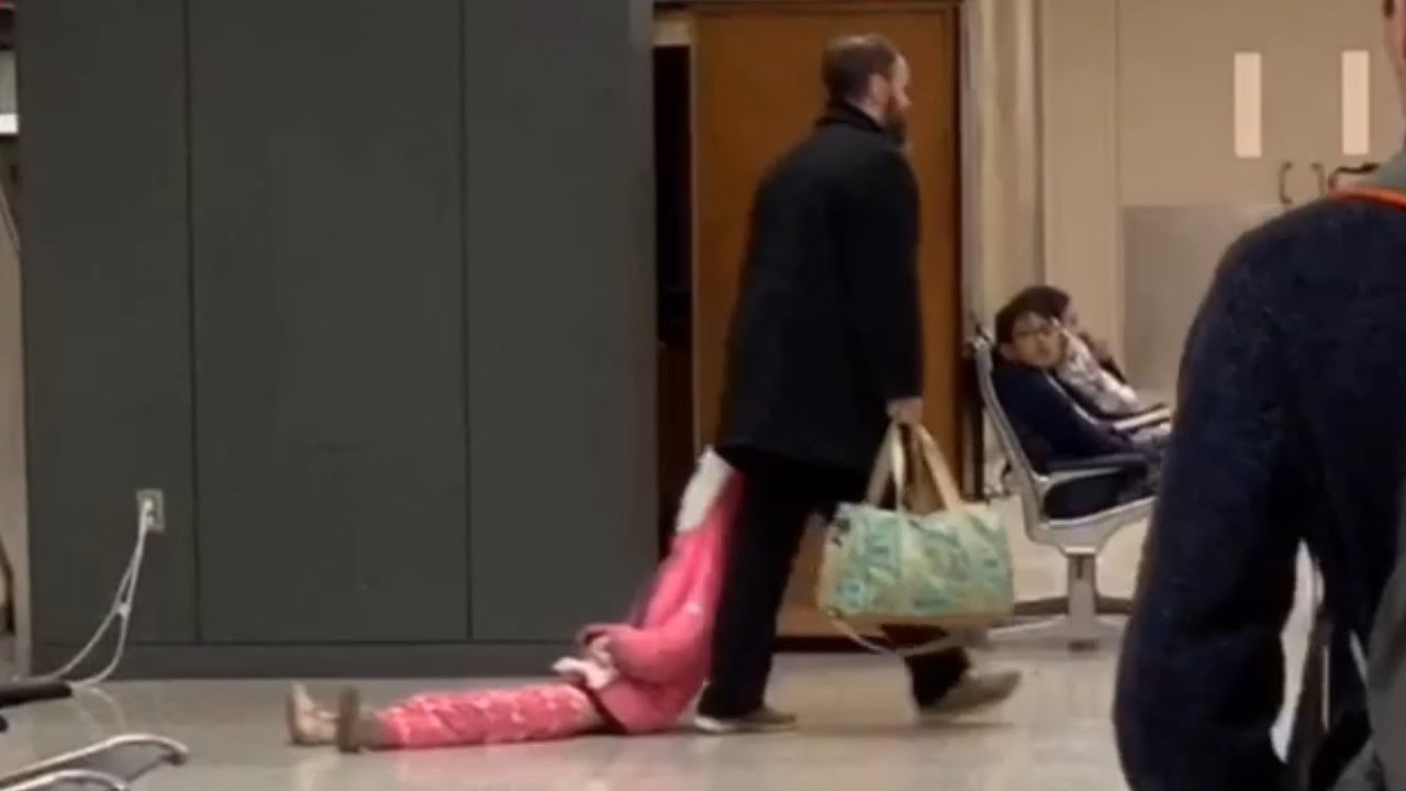 Dad Drags Daughter Through Airport