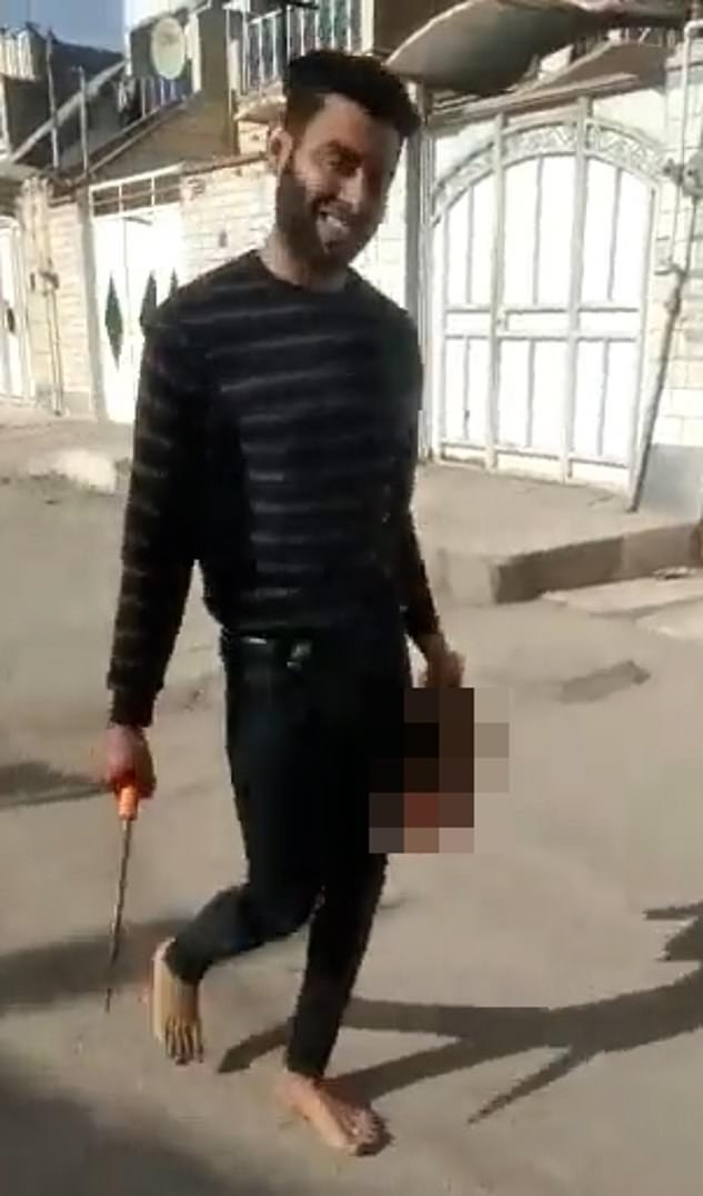 Grinning Iranian husband carries the severed head of his 17-year-old wife through the streets after decapitating her in 'honour killing': Girl murdered after her father and brother dragged her back from Turkey where she'd fled