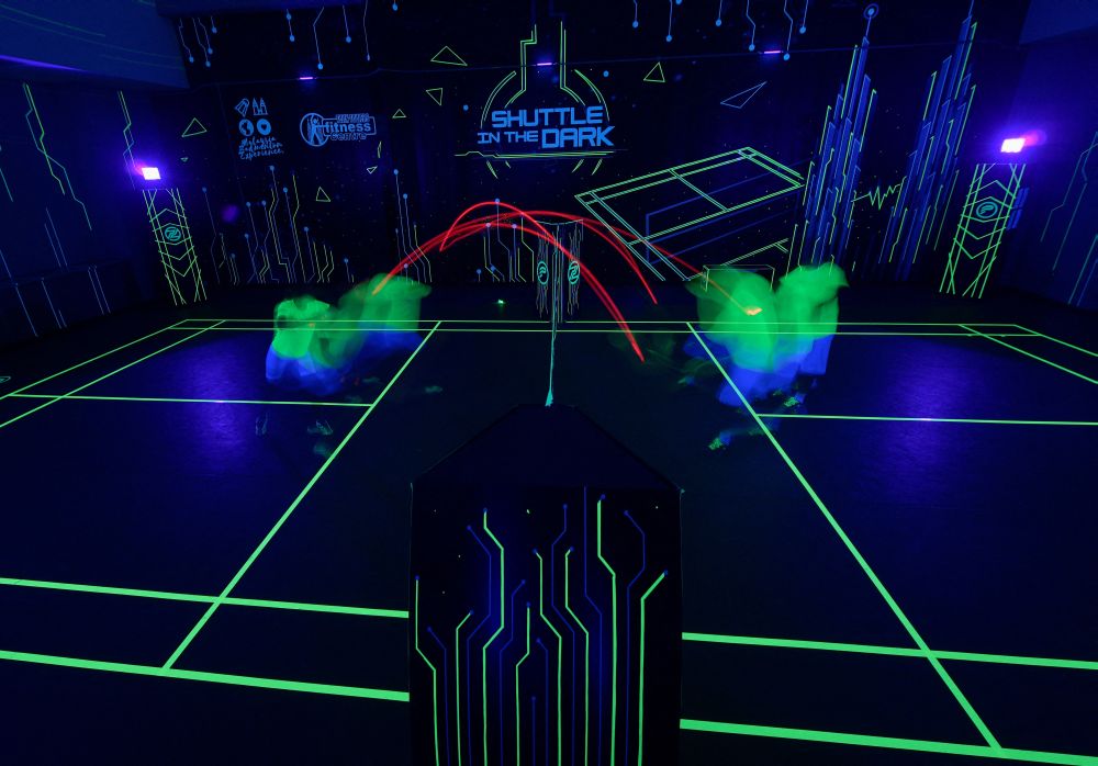 Glow-in-the-dark badminton entices Malaysian players back onto court