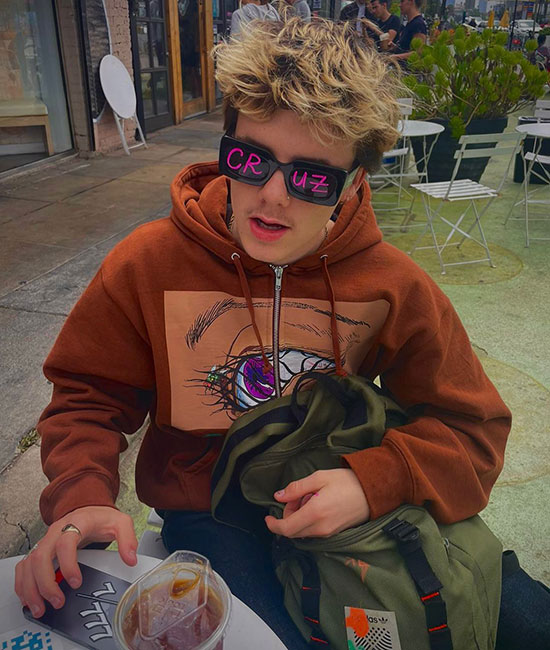 Cruz Beckham rocks out in rave shades on Miami superyacht