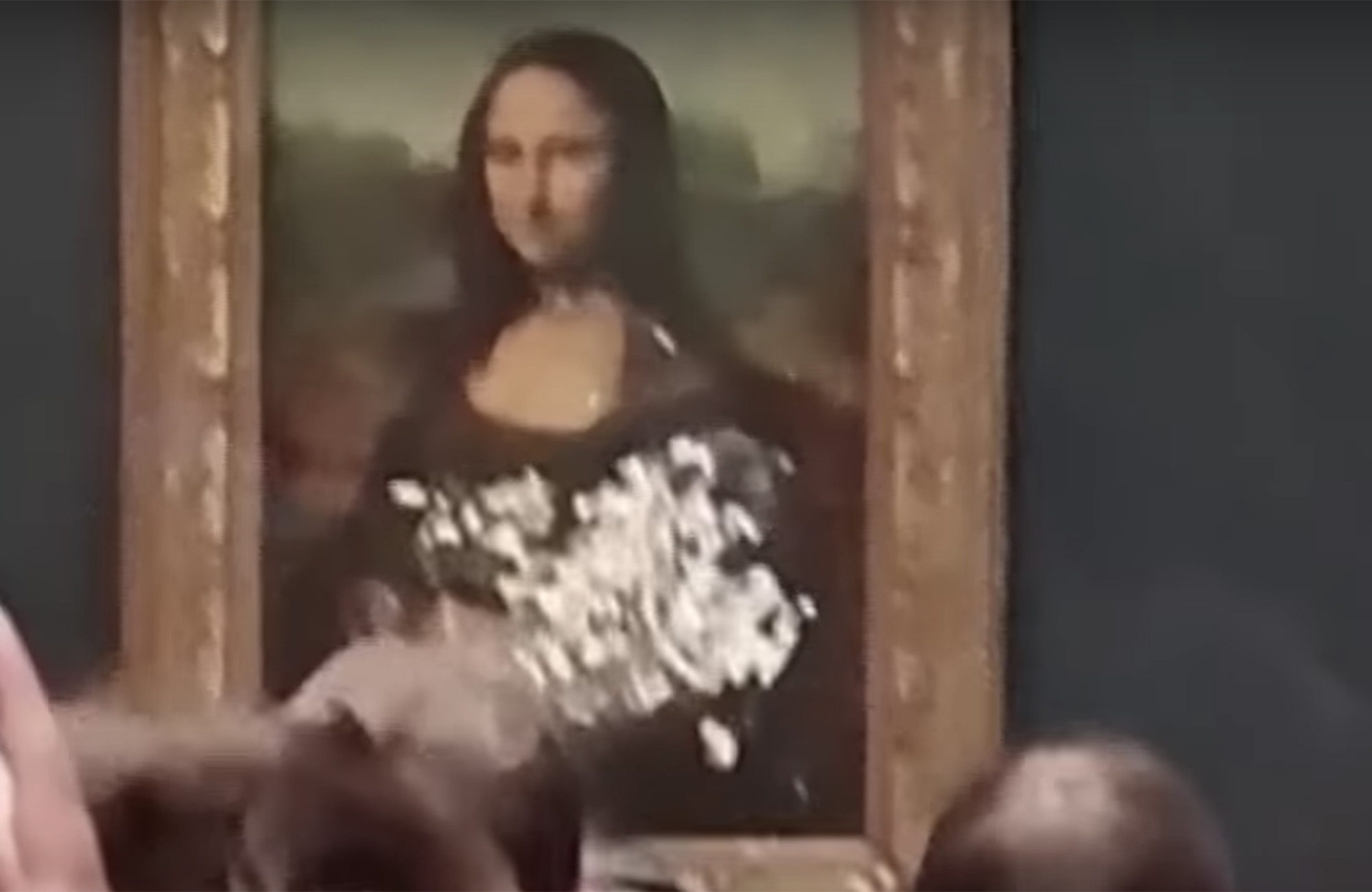 Viral Video Shows Mona Lisa Covered in Cake After Man Disguised in Wig Vandalizes Painting