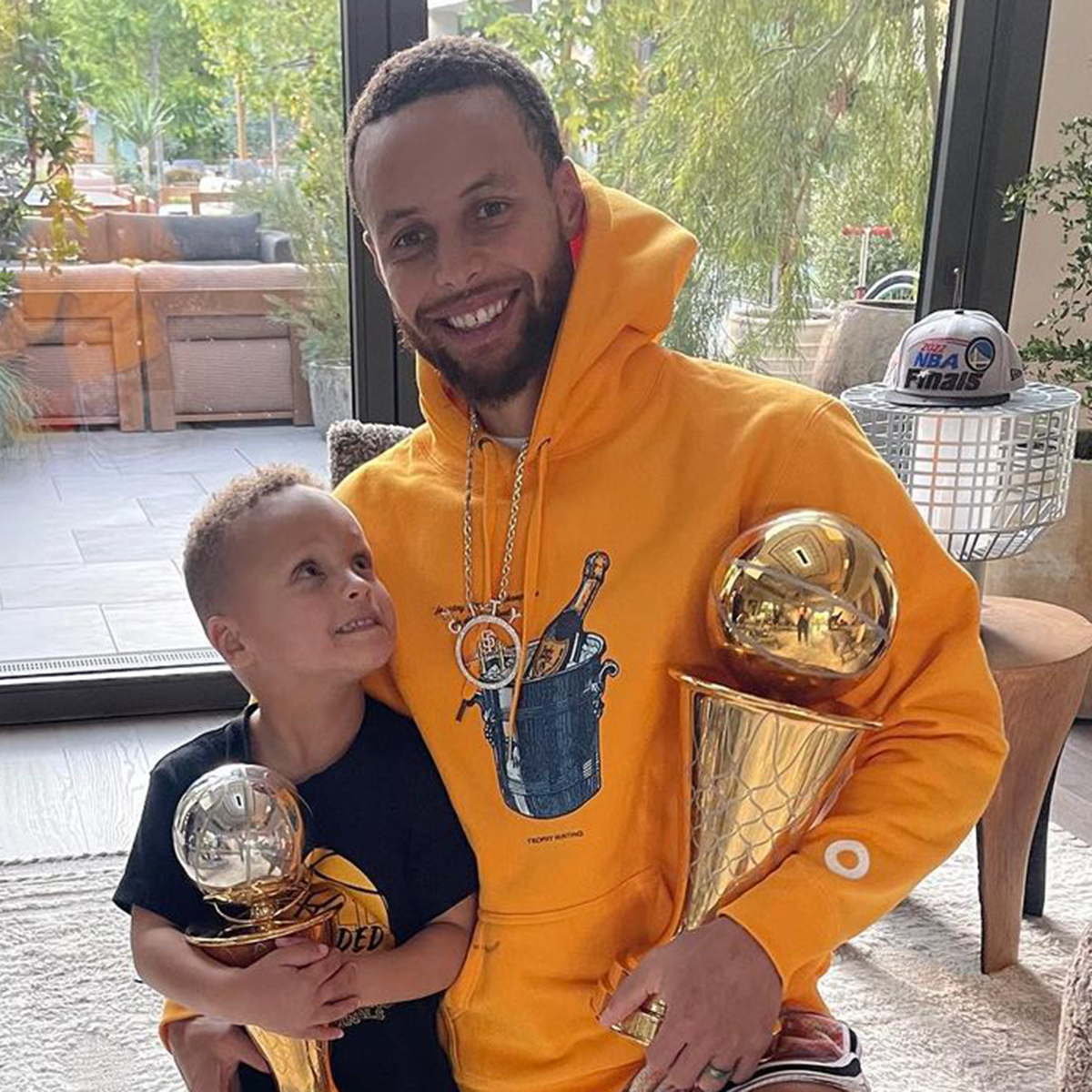 Stephen Curry's Son Cuddles Up to Dad as They Celebrate His NBA Finals Win