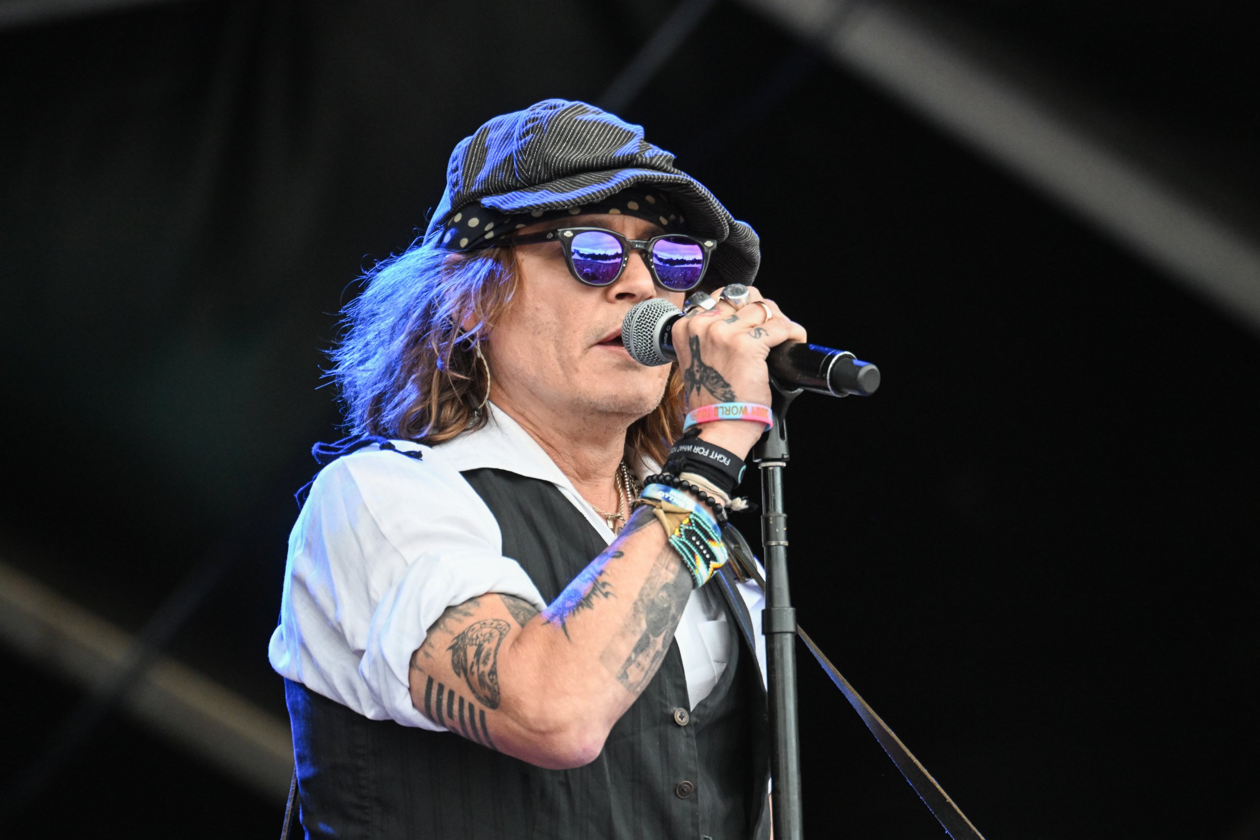 Johnny Depp debuts newly clean-shaven look while rocking out with Jeff Beck at Finland tour show