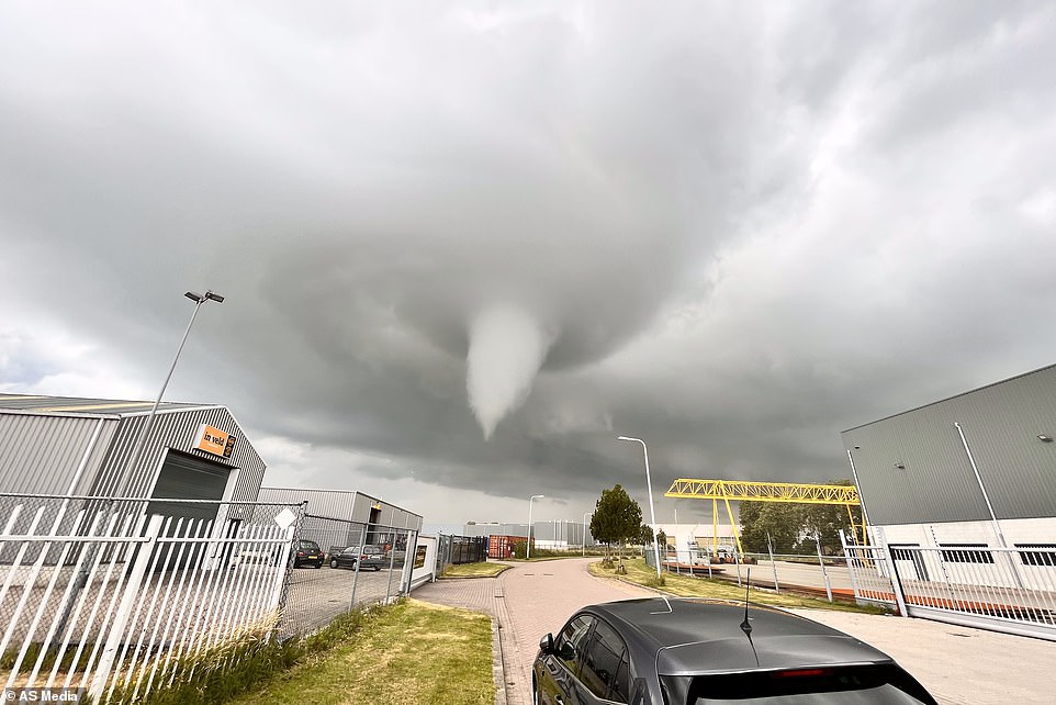 Dutch tornado kills at least one person and injures ten others as it leaves trail of destruction and destroys houses in coastal city 'turned into war zone'