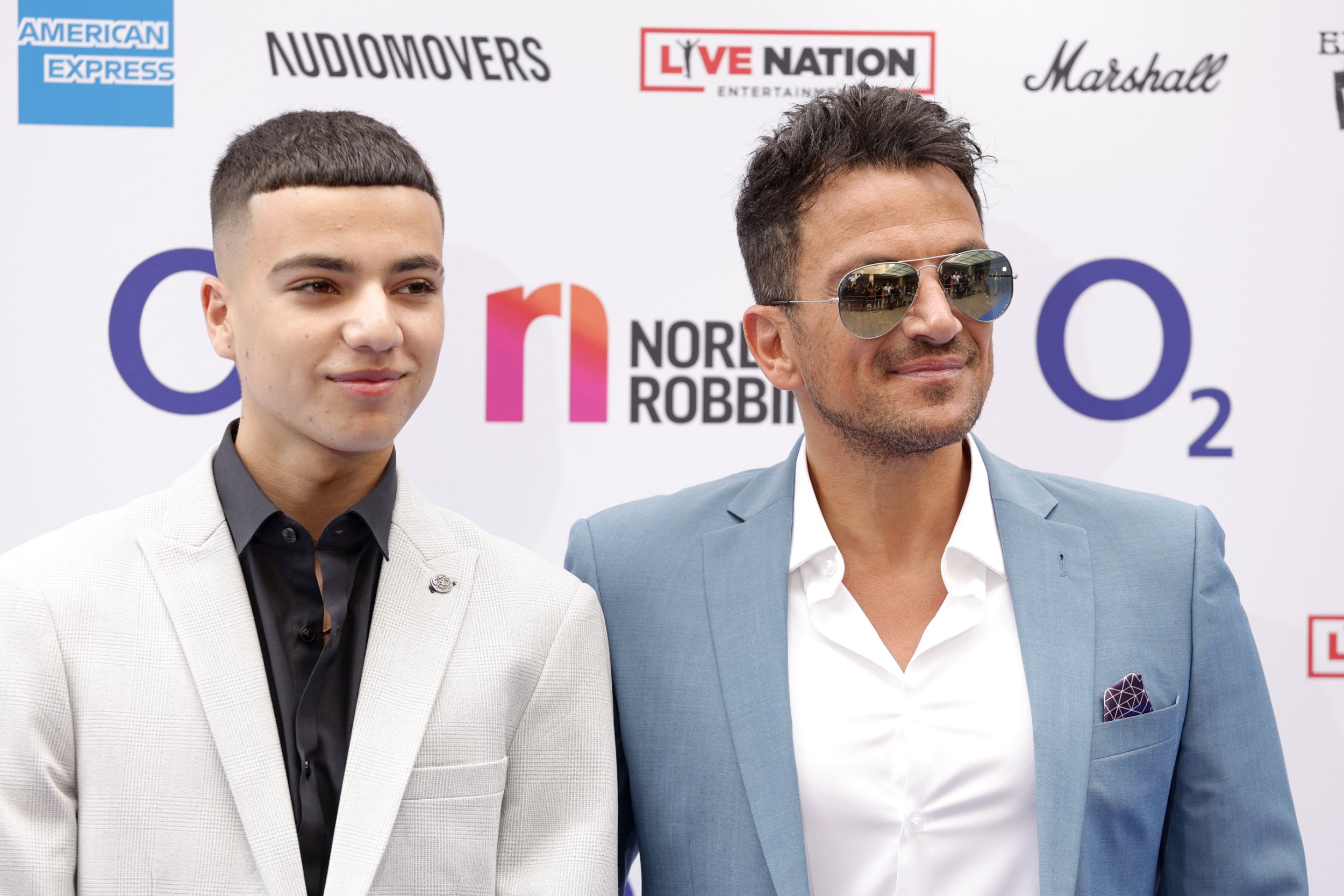 Peter Andre and son Junior embrace at awards show as teenager launches own music career