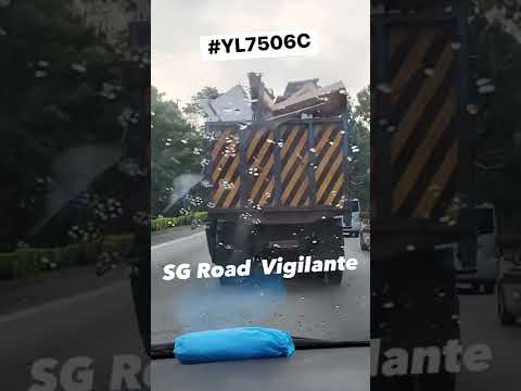 bke nissan dump truck carrying load on a motor vehicle in a dangerous manner