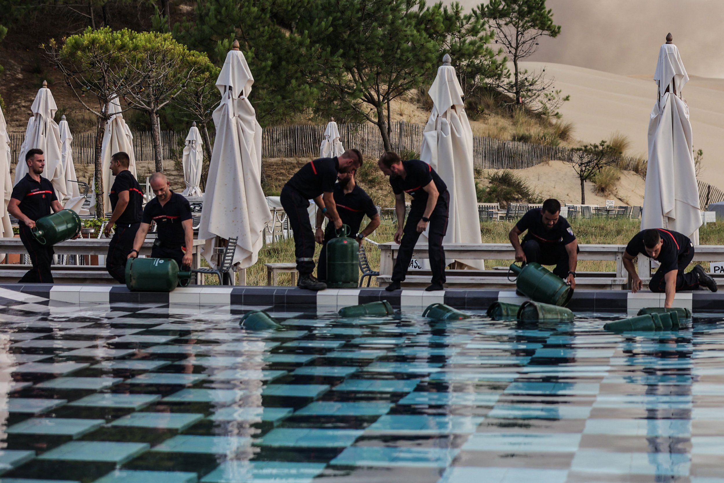 Gas cylinders thrown into swimming pool to stop them exploding in the heat