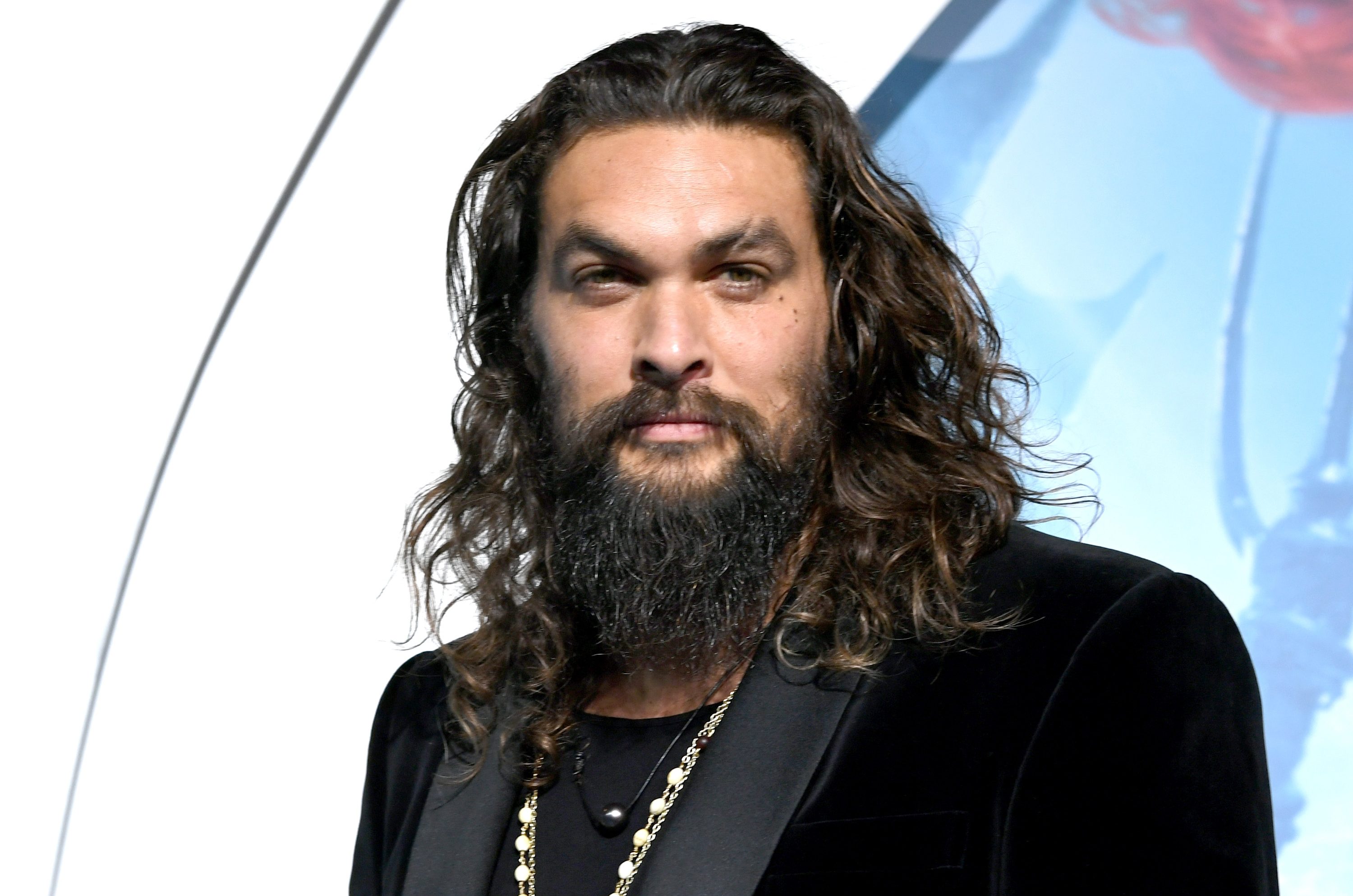 Jason Momoa stuns passengers as he turns into real-life Aquaman by handing bottles of water out on flight