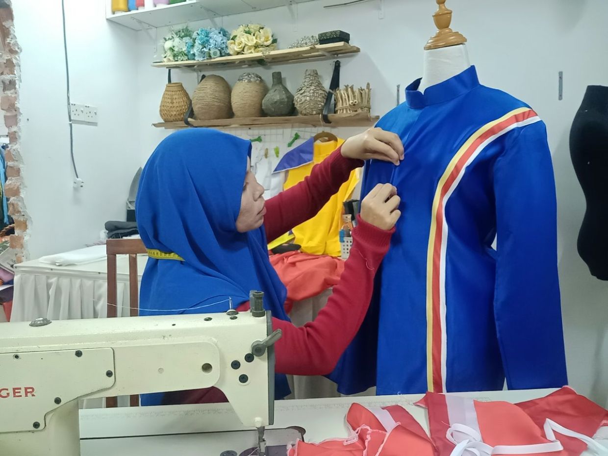 Malaysian tailor stitches Merdeka outfits inspired by epic 'Mat Kilau' movie