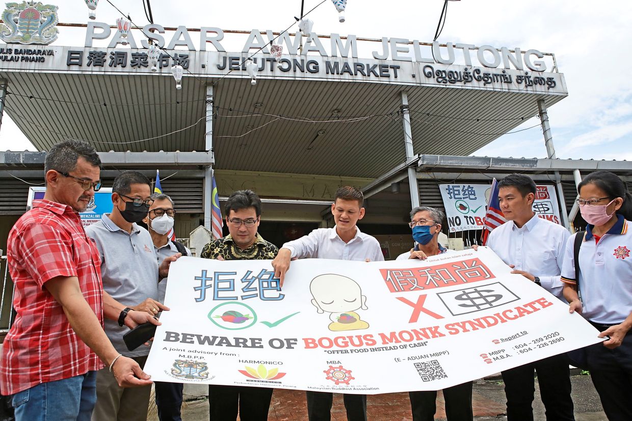 Banners to warn public of bogus monks