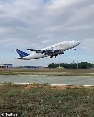 Shocking moment a wheel FALLS OFF Boeing Dreamlifter after taking off in Italy and heading to US